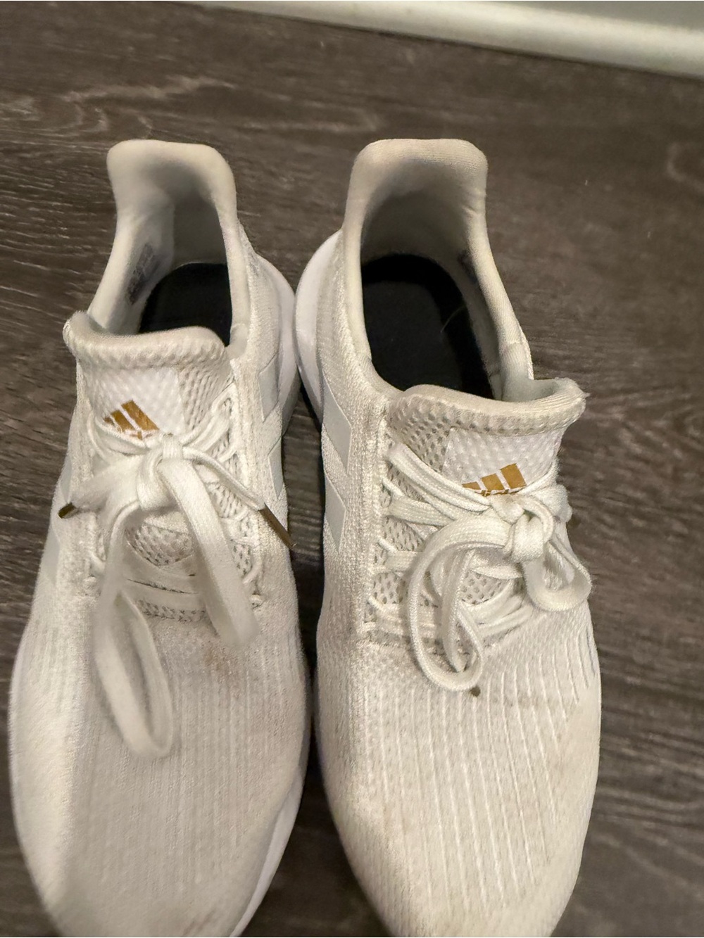 adidas Women’s White Sneakers with Gold Logo Accents